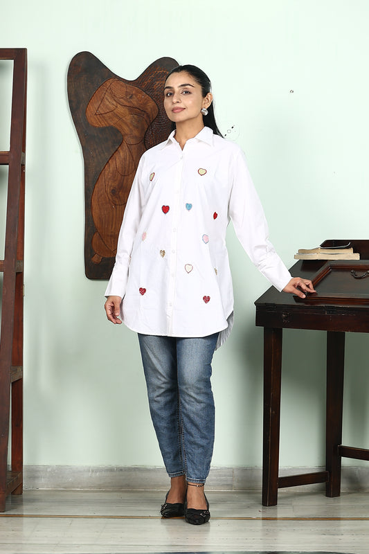 white shirt with heart embellishment
