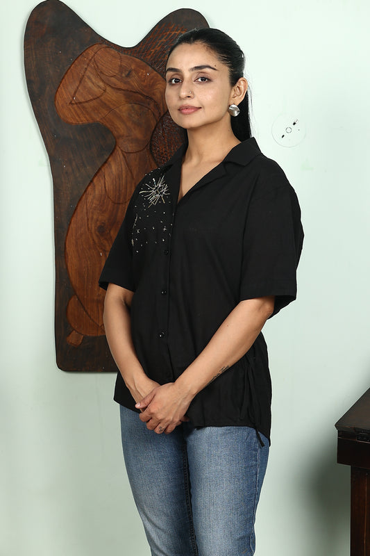 white shirt with heart embellishment